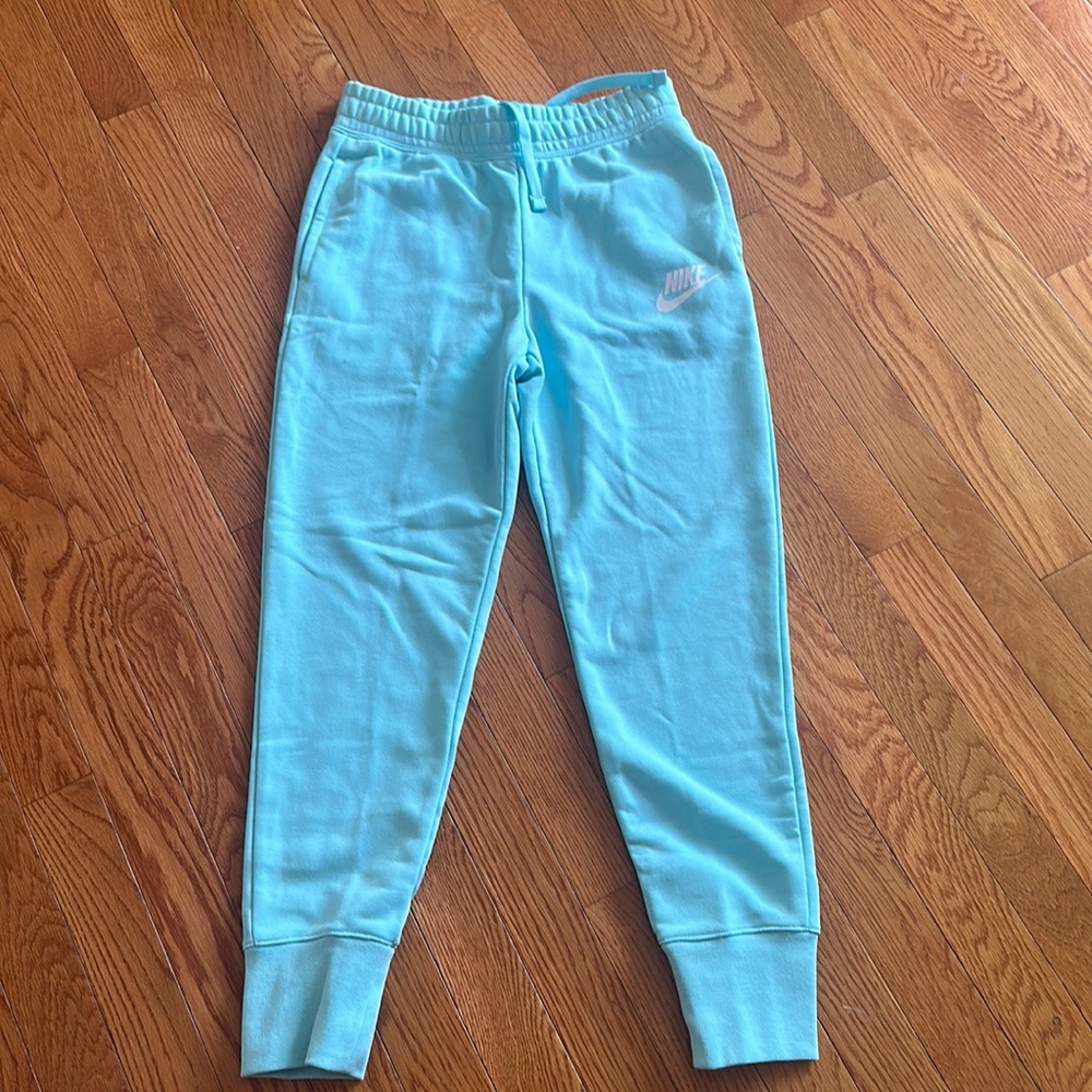 Nike blue slim fit pants new with tags. Size Medium girls